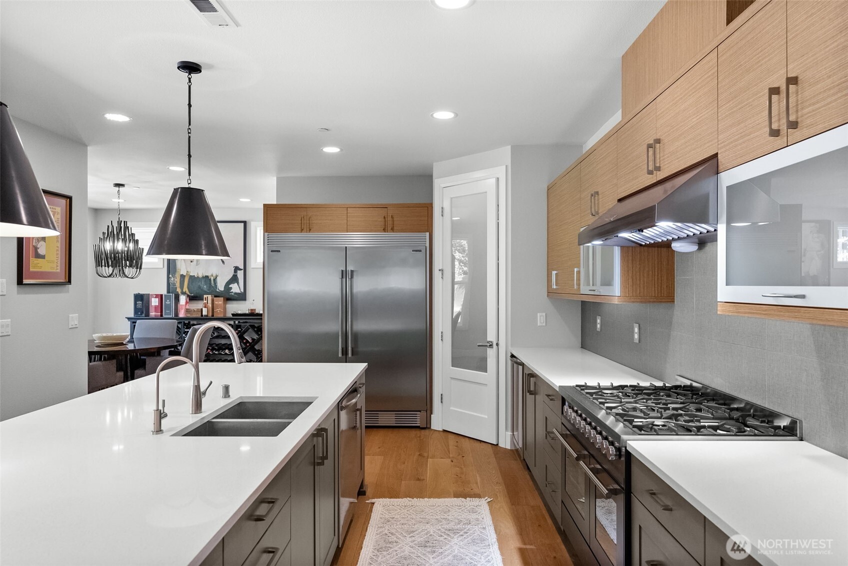 6565 Serenity Loop Gig Harbor, WA 98335 - Photo 13 of 40 a kitchen with stainless steel appliances granite countertop a sink a stove and a refrigerator