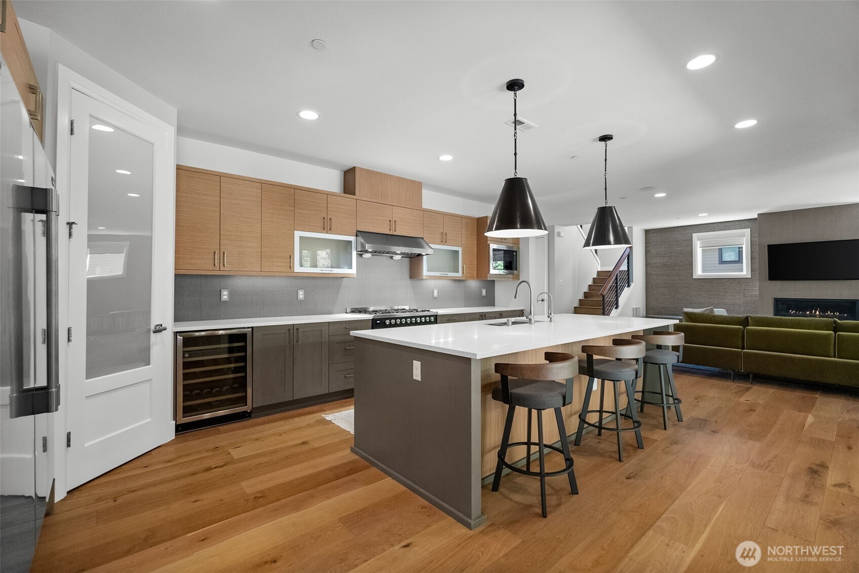 6565 Serenity Loop Gig Harbor, WA 98335 - Photo 14 of 40 a kitchen with stainless steel appliances granite countertop a stove and cabinets