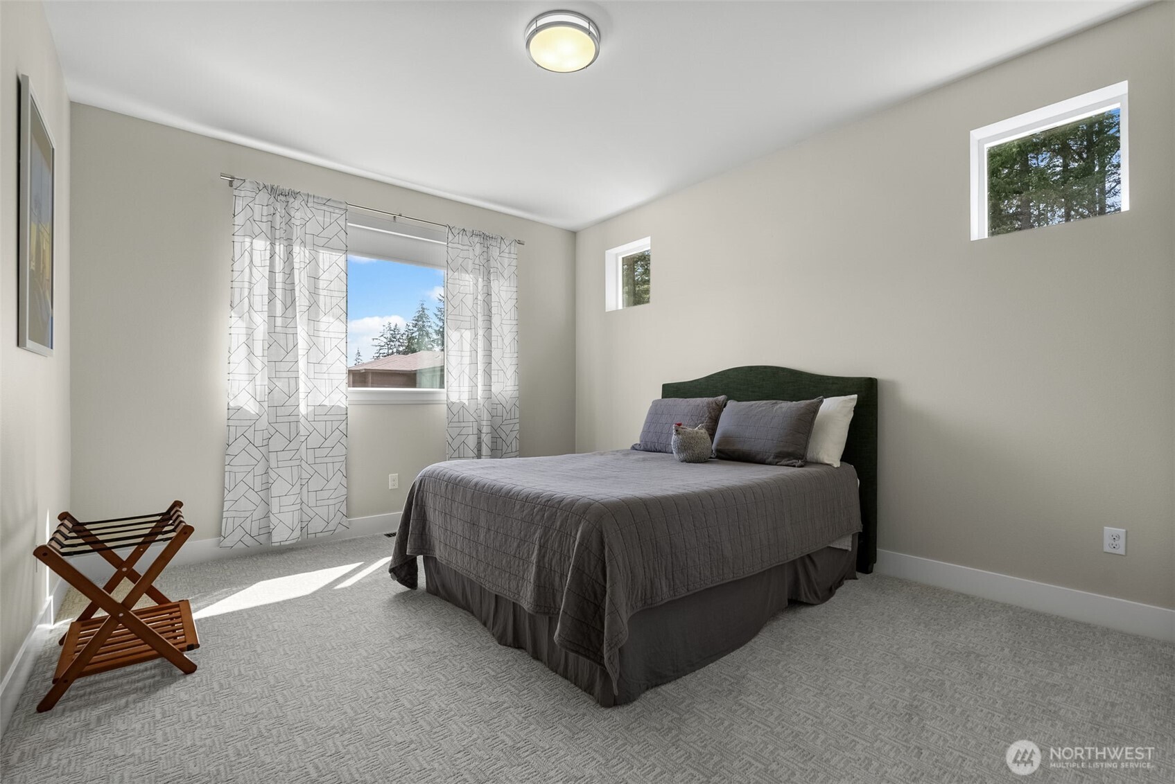 6565 Serenity Loop Gig Harbor, WA 98335 - Photo 22 of 40 a bedroom with a bed chair and window