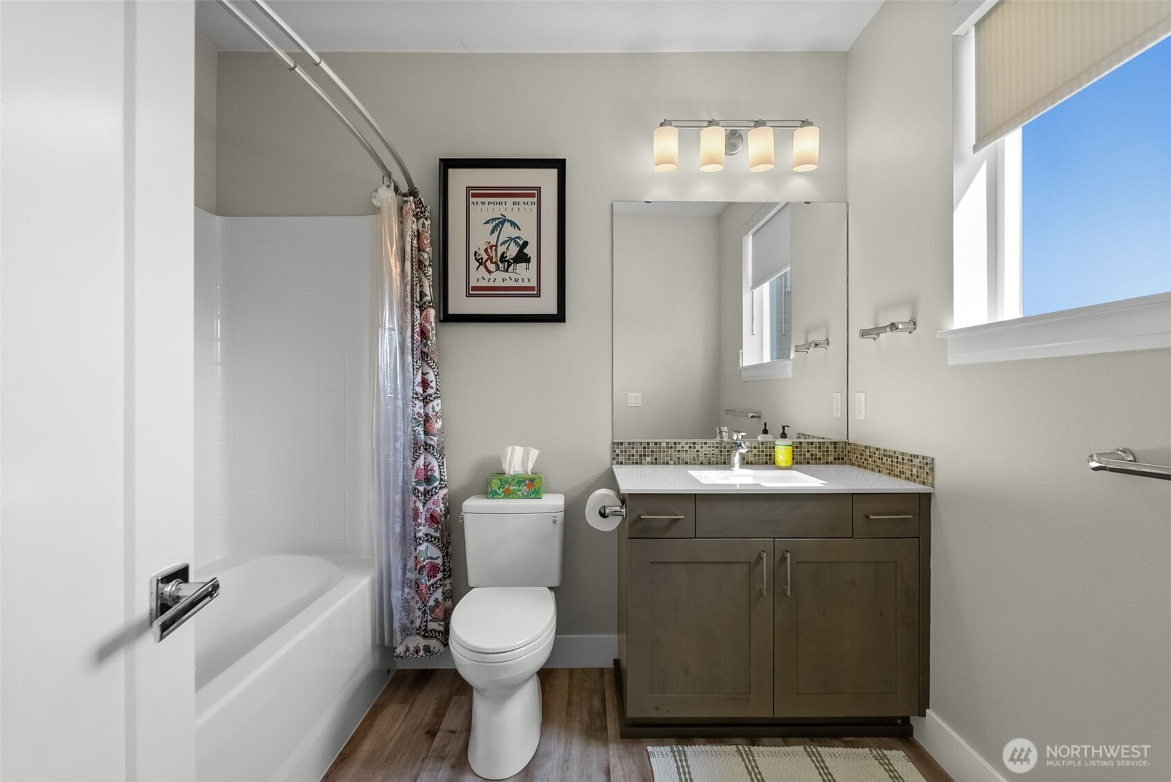 6565 Serenity Loop Gig Harbor, WA 98335 - Photo 24 of 40 a bathroom with a granite countertop toilet sink and mirror