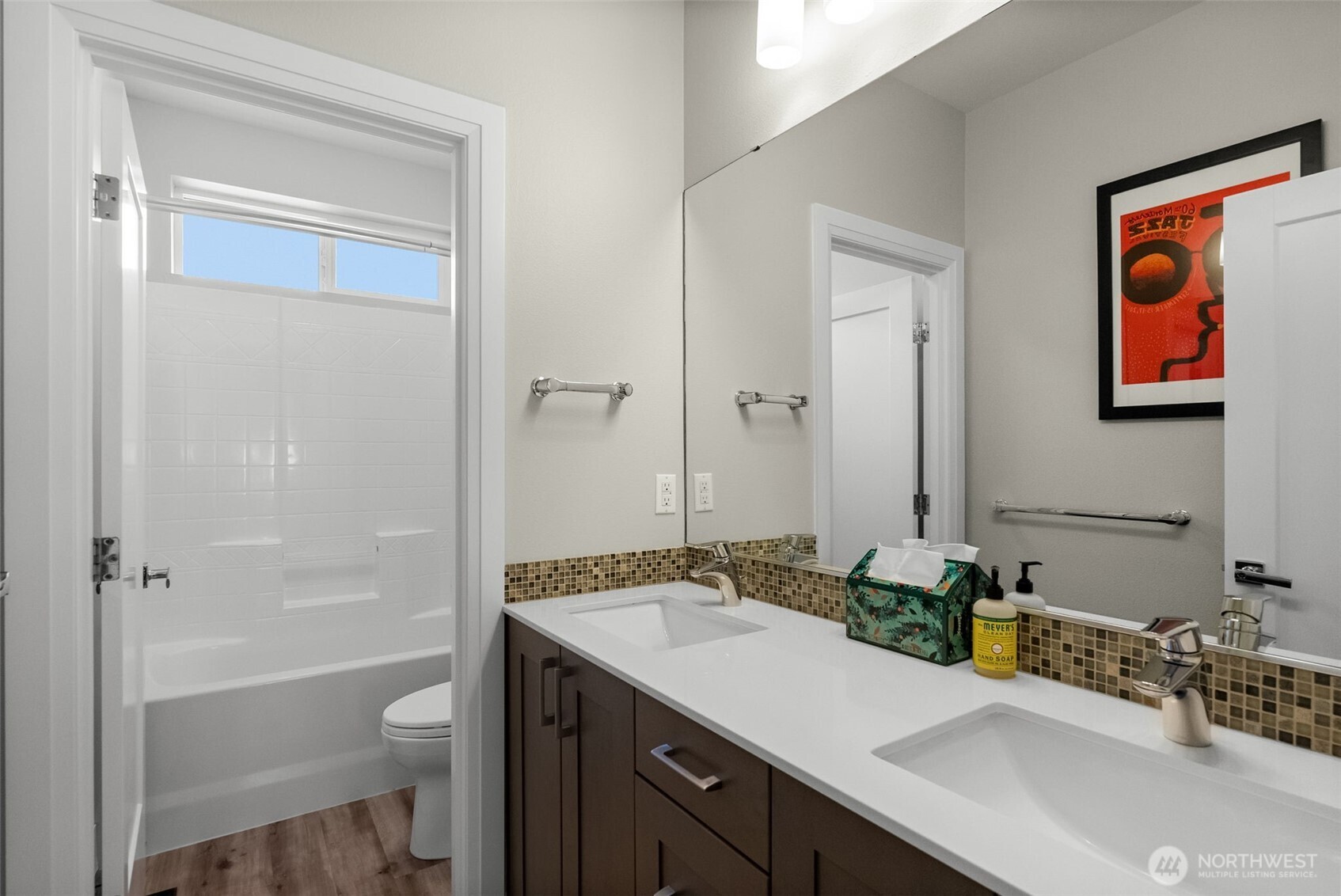 6565 Serenity Loop Gig Harbor, WA 98335 - Photo 30 of 40 a bathroom with a granite countertop sink mirror toilet and bathtub