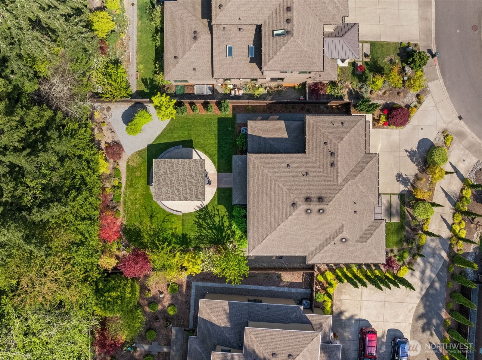 6565 Serenity Loop Gig Harbor, WA 98335 - Photo 39 of 40 a aerial view of a house with a garden and swimming pool