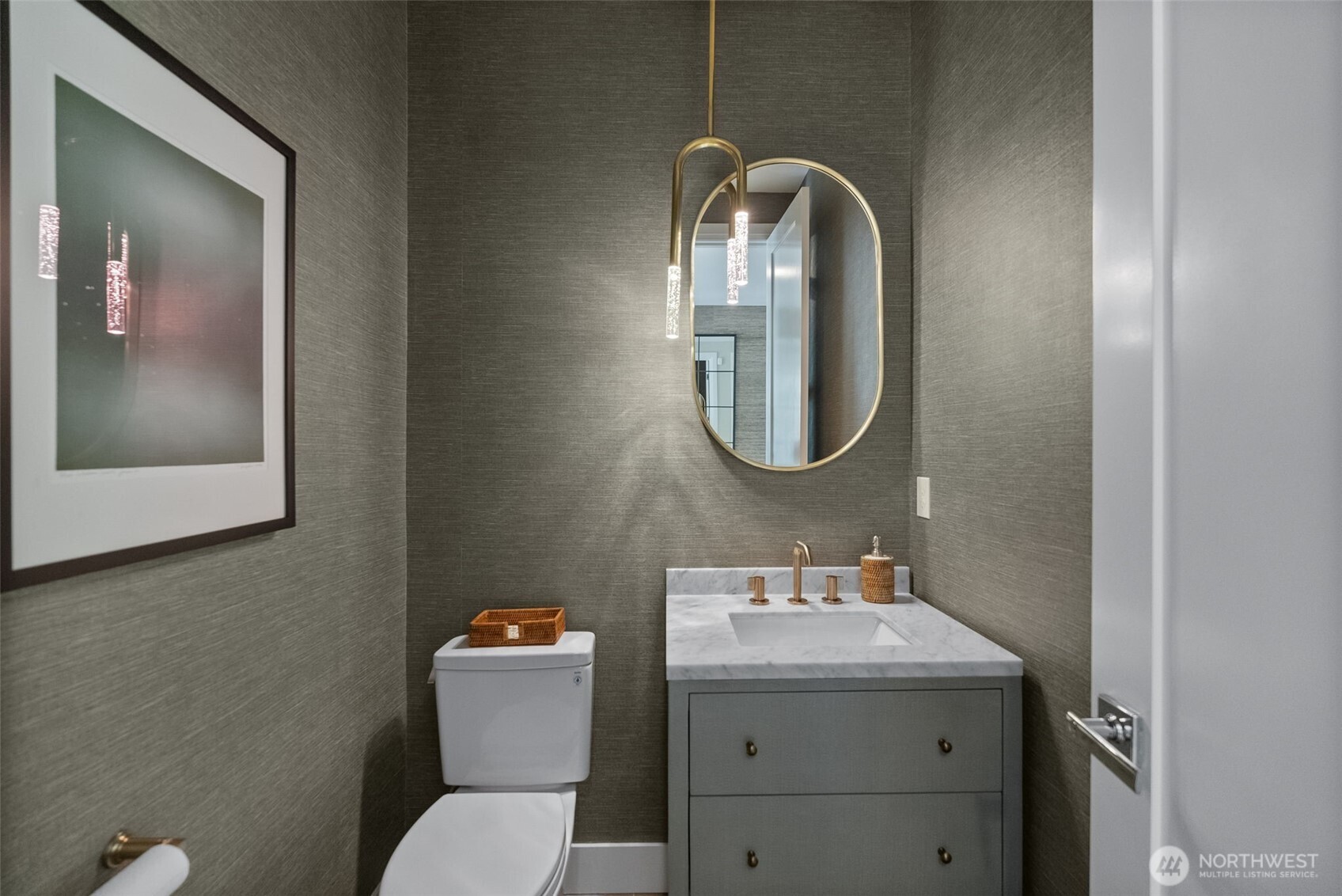 6565 Serenity Loop Gig Harbor, WA 98335 - Photo 7 of 40 a bathroom with a toilet sink and mirror