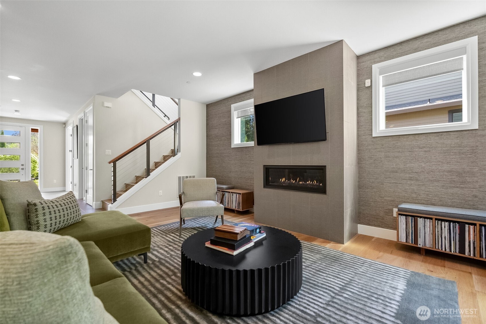 6565 Serenity Loop Gig Harbor, WA 98335 - Photo 10 of 40 a living room with furniture and a flat screen tv