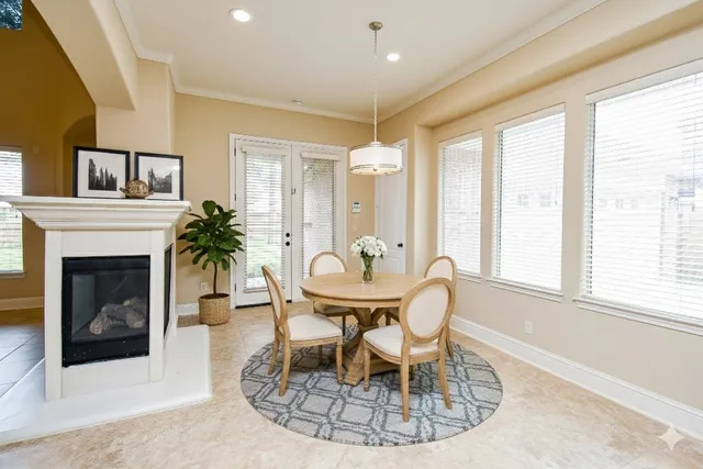 a living room with furniture a window and a fireplace