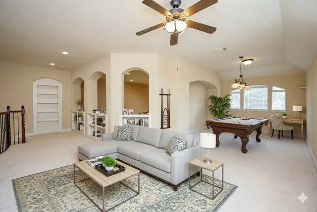 a living room with furniture and a large window