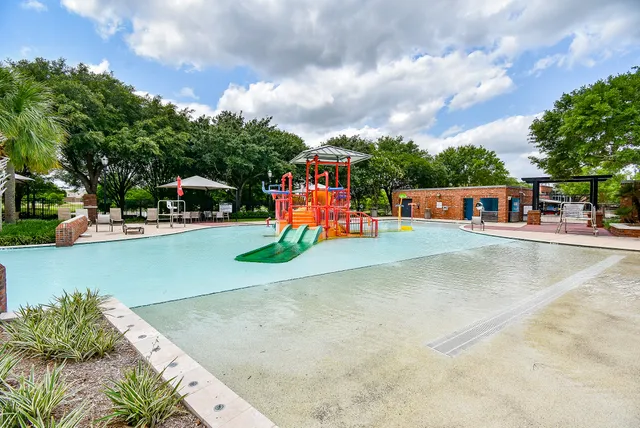 a view of a park with swings and slides