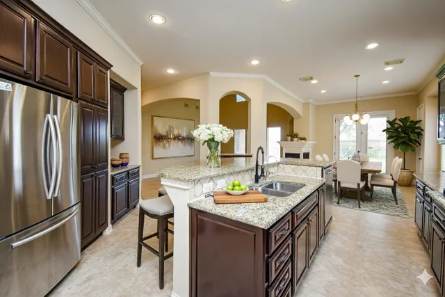 a kitchen with a refrigerator and a sink