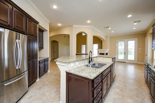 a kitchen with sink refrigerator and outdoor view