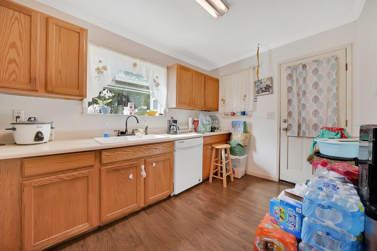 329 Pinecone Lane West Point, CA 95255 - Photo 6 of 12 a kitchen with stainless steel appliances a sink and wooden floor