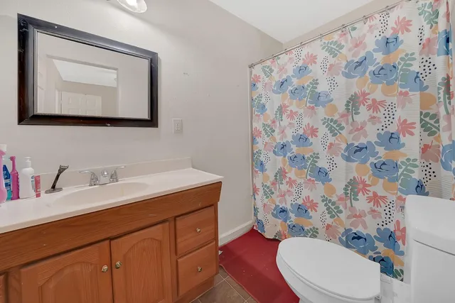 a room with a bed and a window