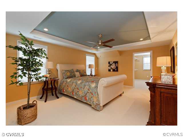 1252 Coalfield Road Midlothian, VA 23114 - Photo 3 of 6 a bedroom with a bed and potted plants