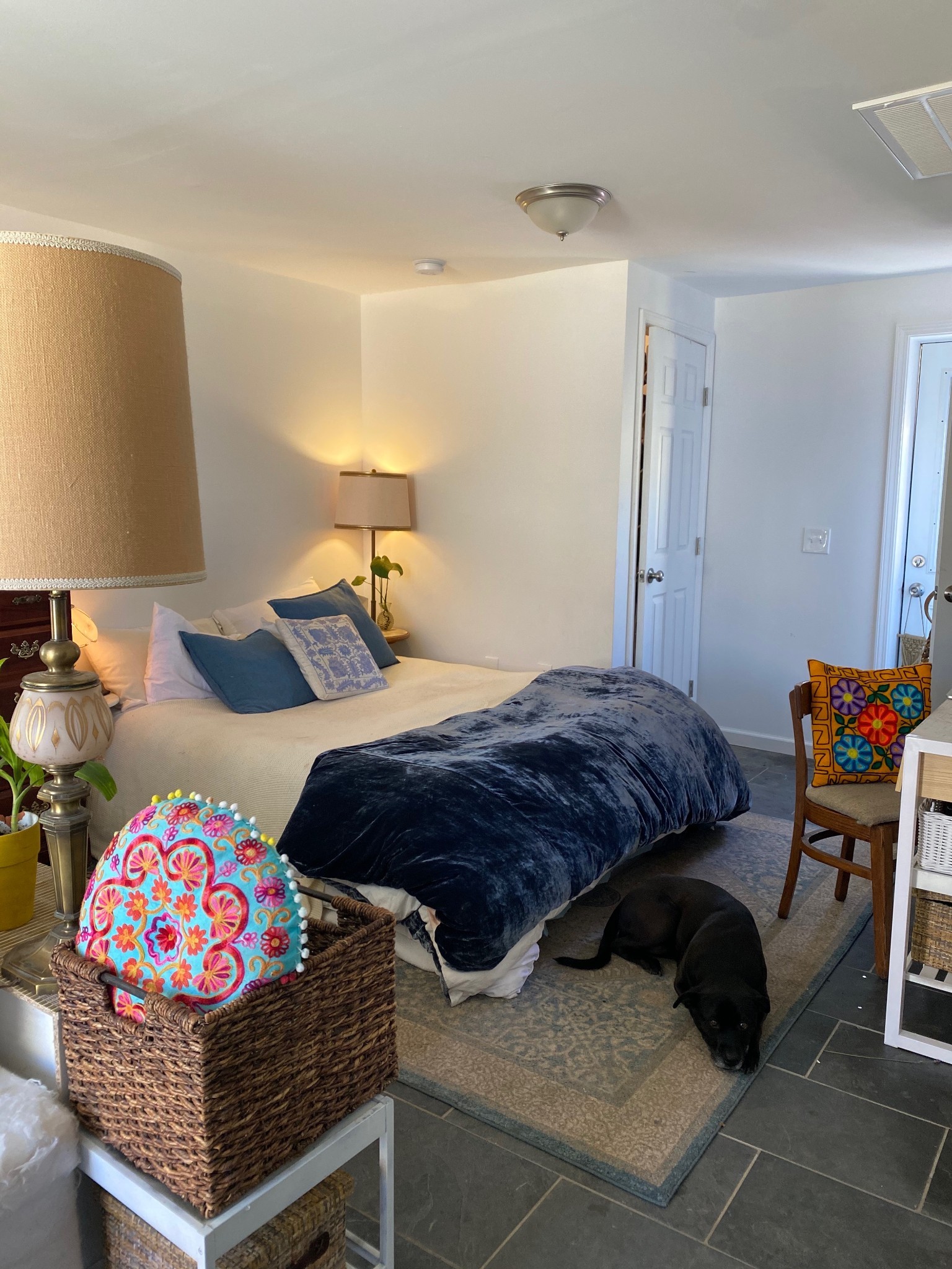 a bedroom with bed and a couch