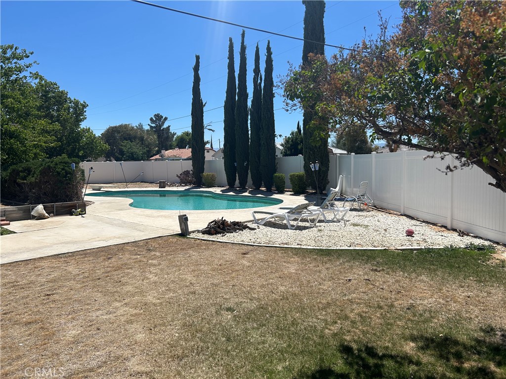 20187 Itasca Road Apple Valley, CA 92308 - Photo 31 of 35 a view of swimming pool with a yard