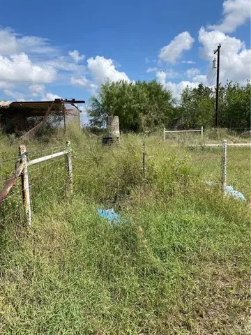 a view of a lake with houses in the background