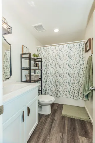 a view of bathroom with bathtub and shower
