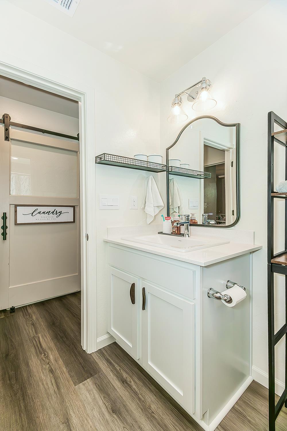 2161 Heidi Avenue Sanger, CA 93657 - Photo 26 of 43 a bathroom with a sink and a mirror