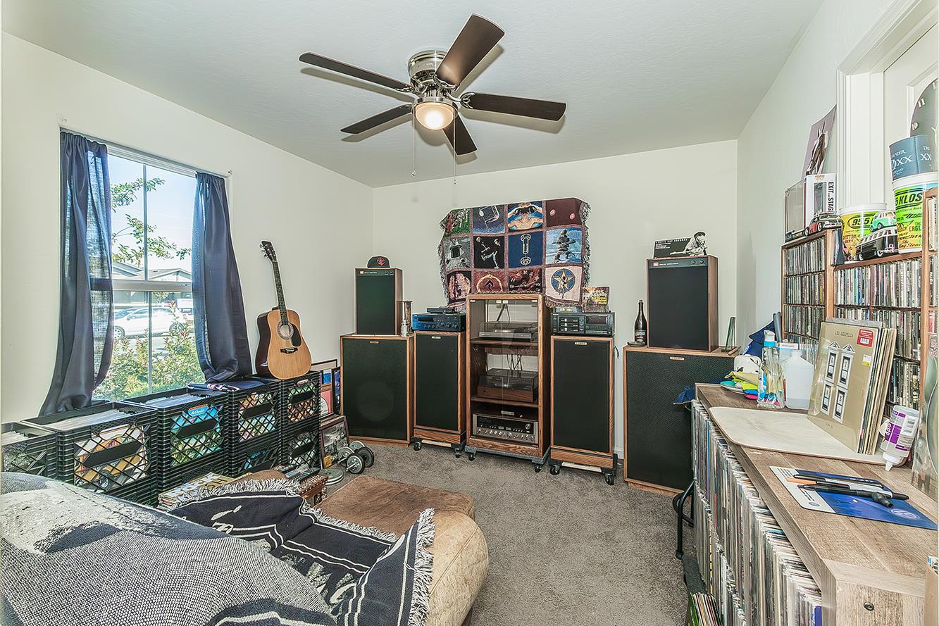 2161 Heidi Avenue Sanger, CA 93657 - Photo 33 of 43 a room with furniture a window and a flat screen tv