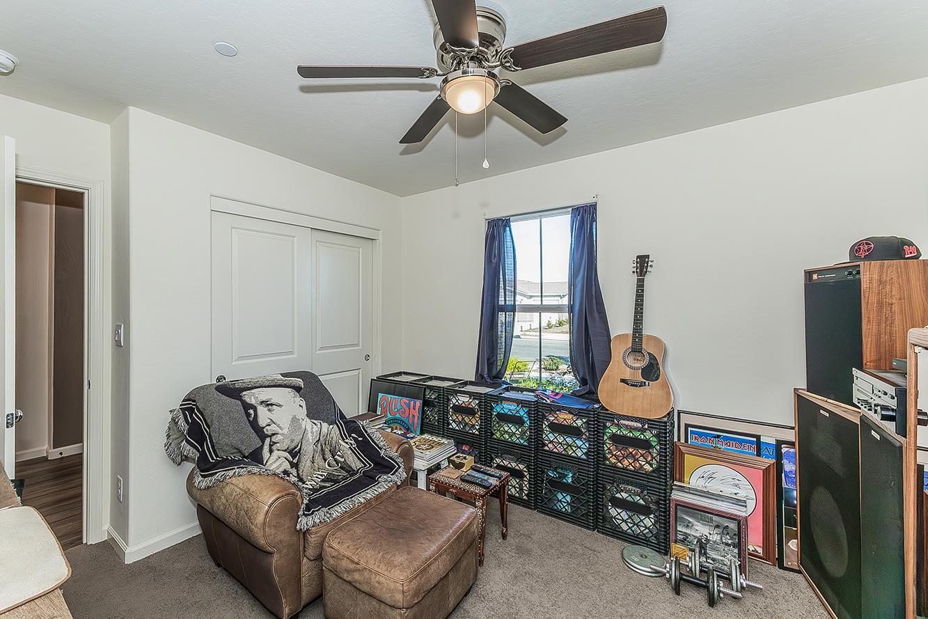 2161 Heidi Avenue Sanger, CA 93657 - Photo 35 of 43 a living room with furniture a flat screen tv and a window