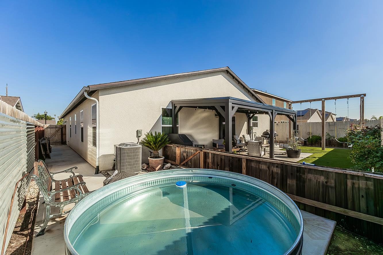 2161 Heidi Avenue Sanger, CA 93657 - Photo 43 of 43 a view of a house with swimming pool and sitting area