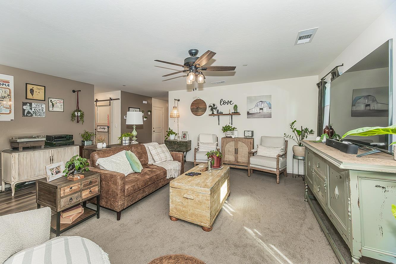 2161 Heidi Avenue Sanger, CA 93657 - Photo 6 of 43 a living room with furniture and a clock