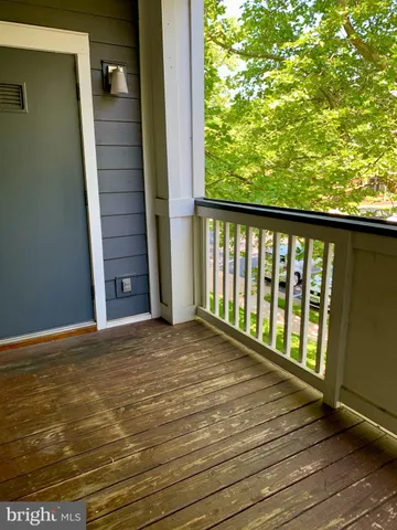 a view of balcony with wooden floor