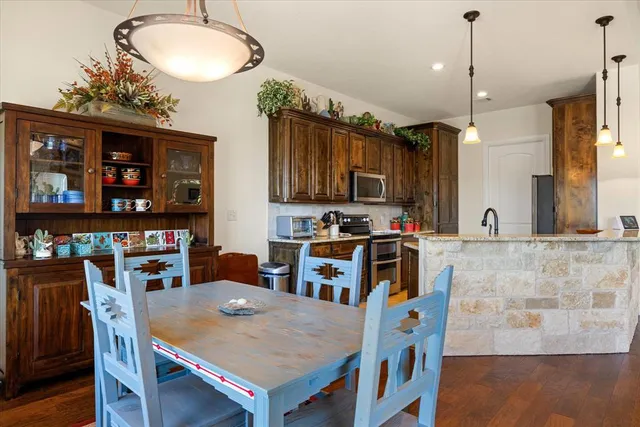 a view of kitchen and dining area with furniture