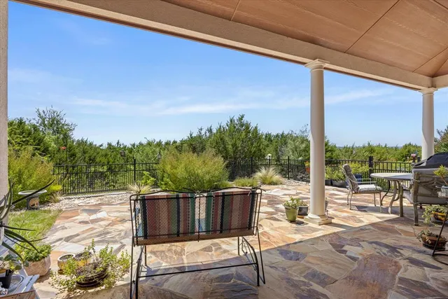 a view of balcony with furniture