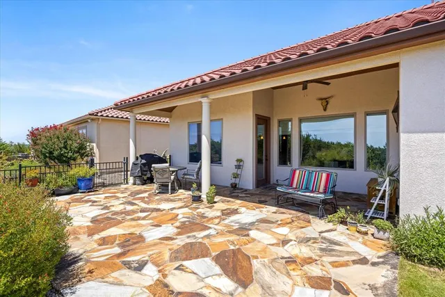 a view of a lounge chairs in the patio
