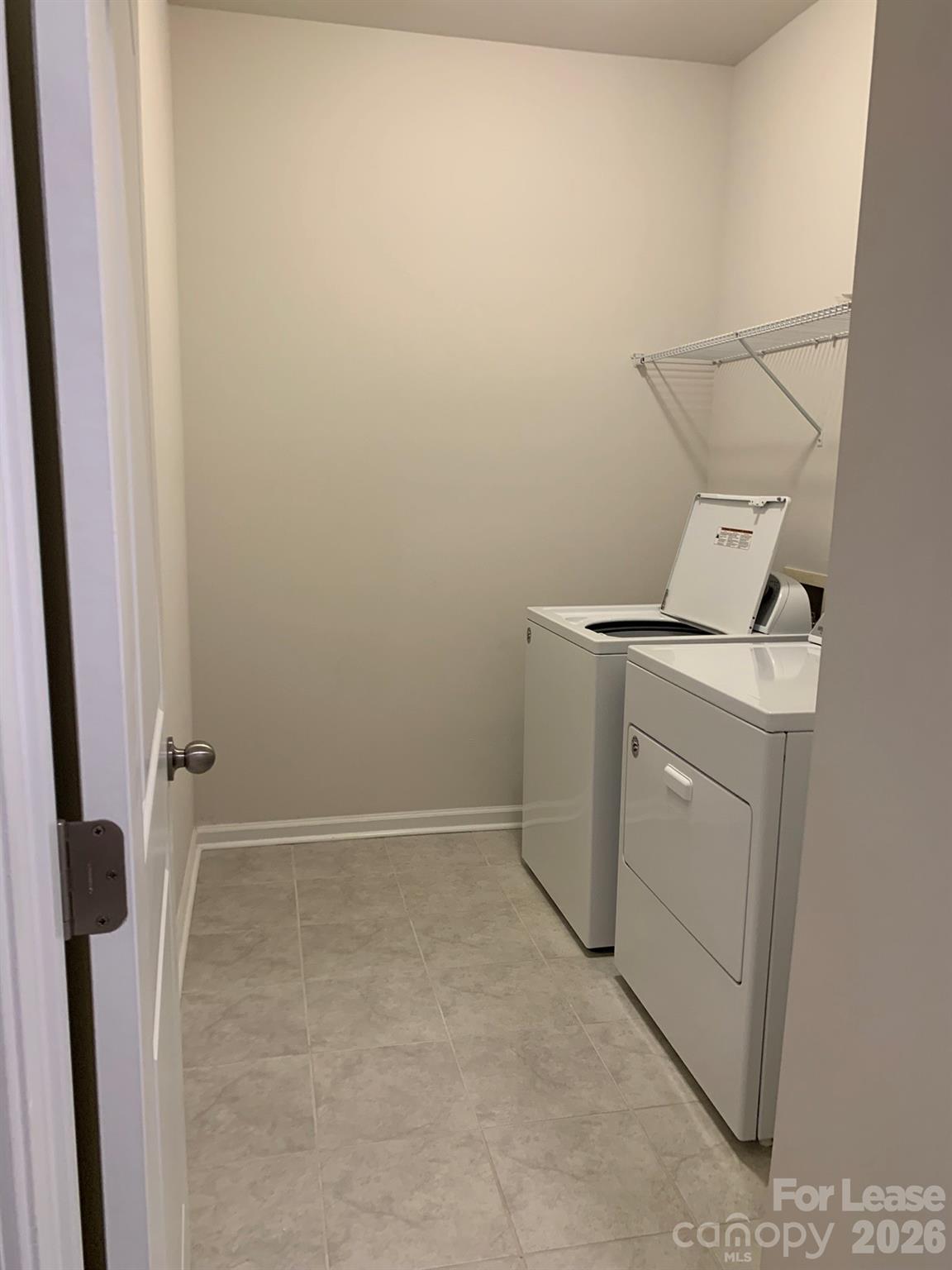 2143 Stevens Mill Road Matthews, NC 28104 - Photo 27 of 39 a utility room with dryer and washer