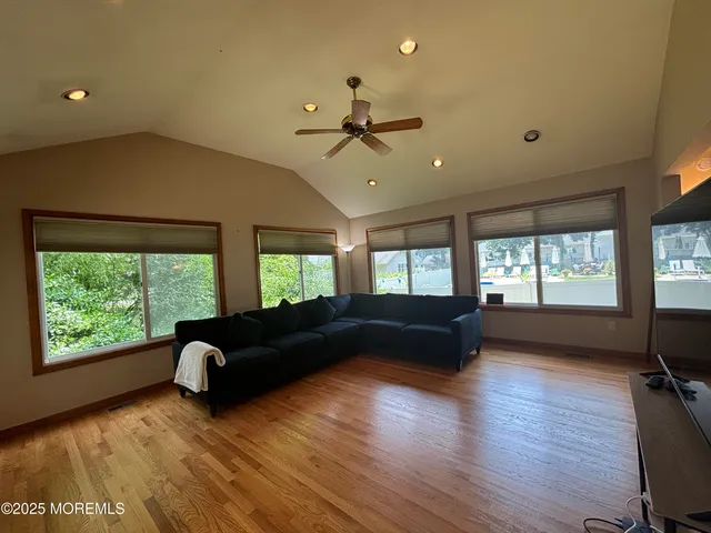 a living room with furniture window and wooden floor