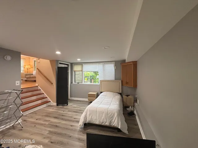 a bed room with a bed and a window