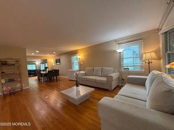 a living room with furniture and a table