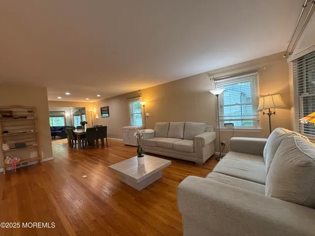 a living room with furniture and a table