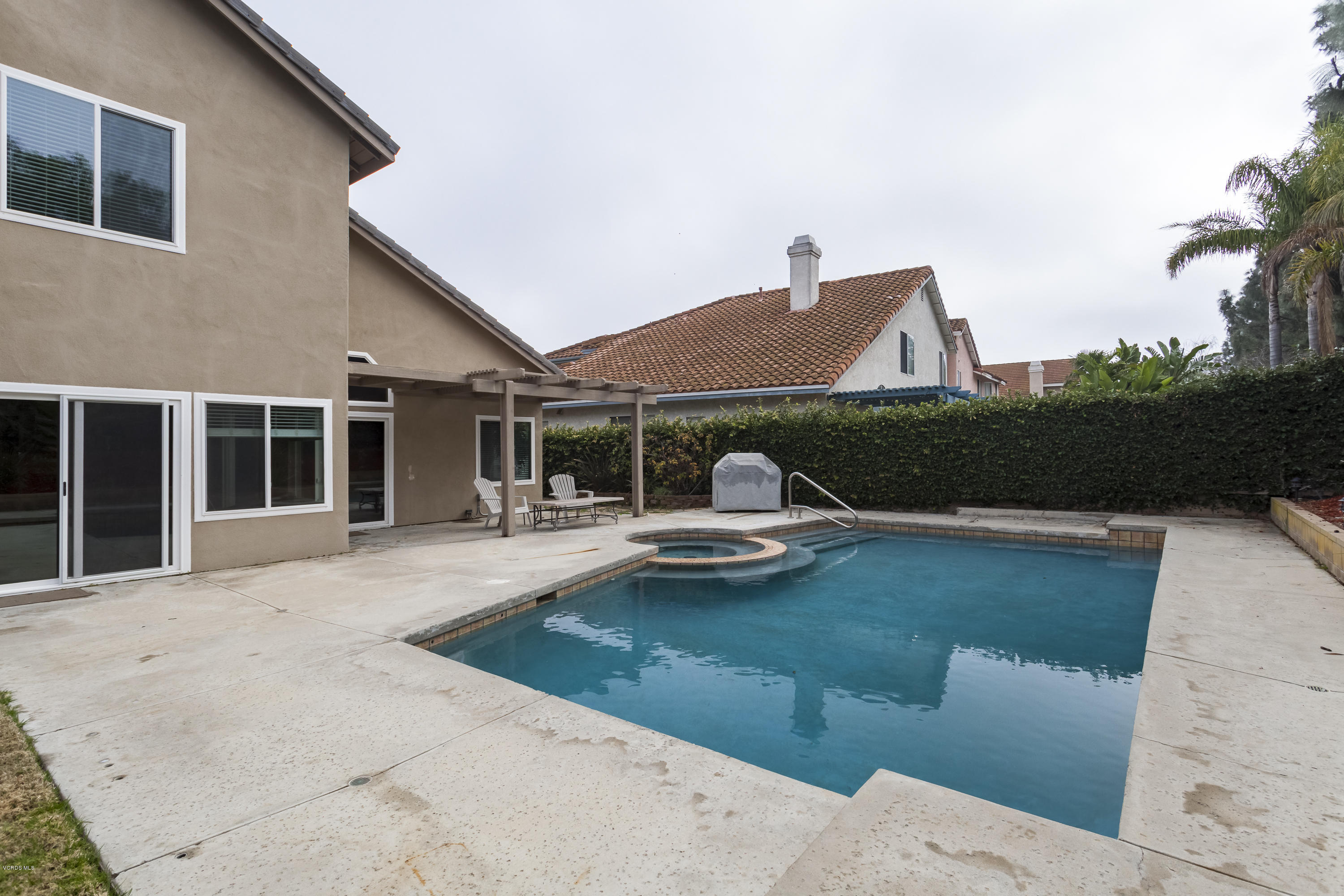12142 Cherry Grove Street Moorpark, CA 93021 - Photo 11 of 36 a front view of a house with swimming pool having outdoor seating
