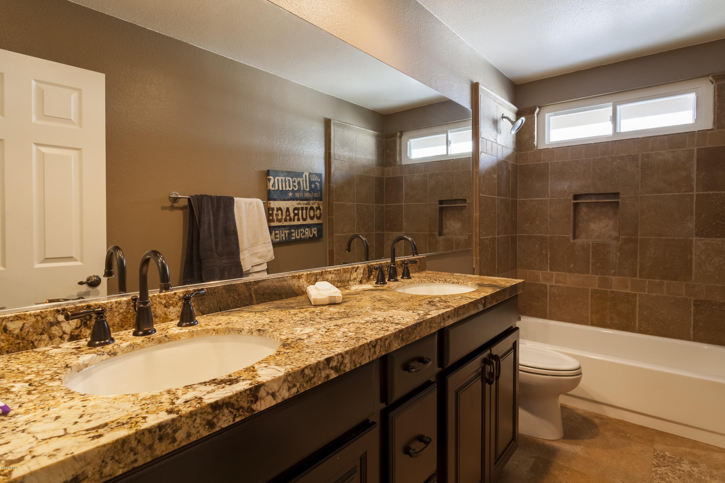 12142 Cherry Grove Street Moorpark, CA 93021 - Photo 16 of 36 a bathroom with a granite countertop bathtub sink vanity mirror and toilet