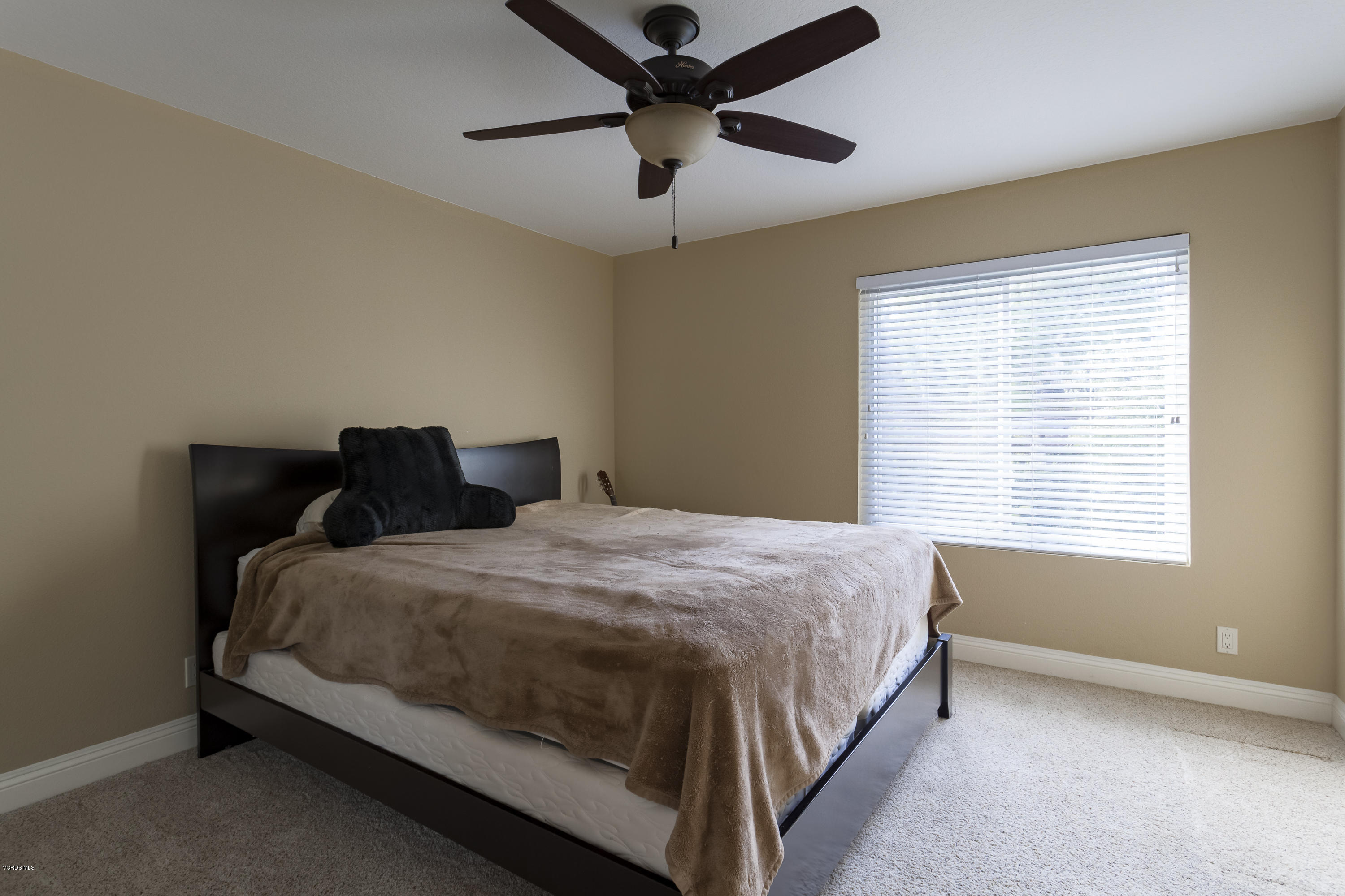 12142 Cherry Grove Street Moorpark, CA 93021 - Photo 26 of 36 a bedroom with a bed and a window