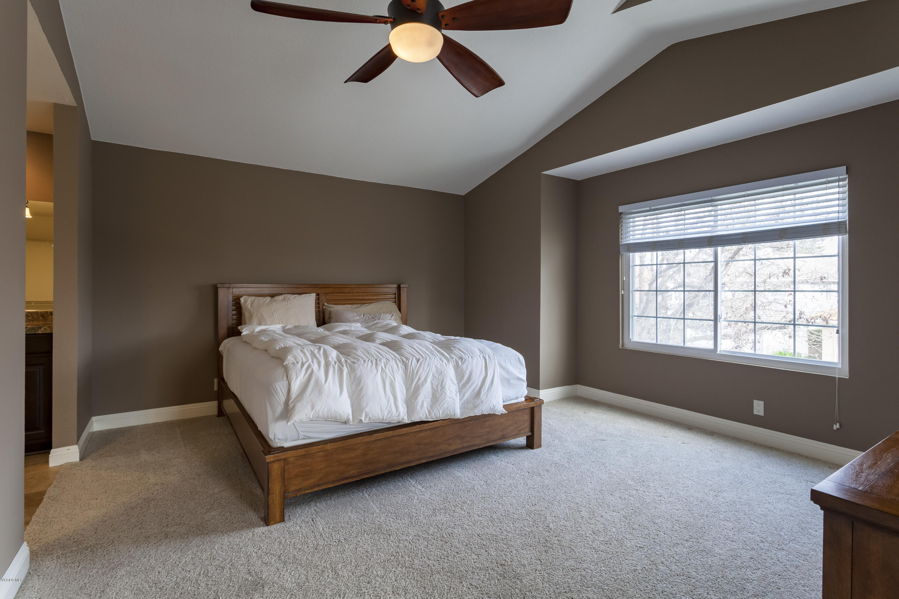 12142 Cherry Grove Street Moorpark, CA 93021 - Photo 30 of 36 a bedroom with a bed and a large window
