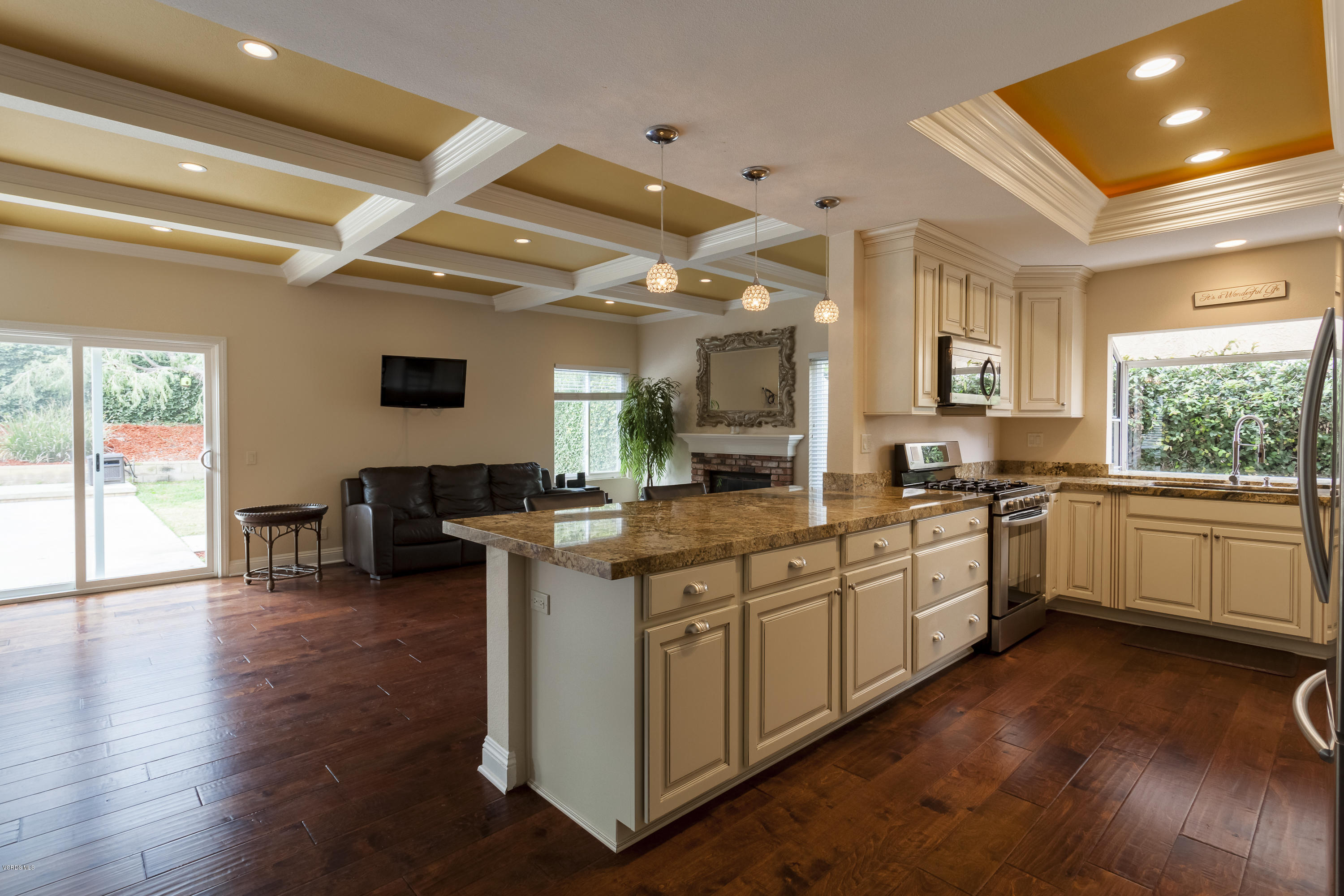 12142 Cherry Grove Street Moorpark, CA 93021 - Photo 8 of 36 a kitchen with sink cabinets and wooden floor