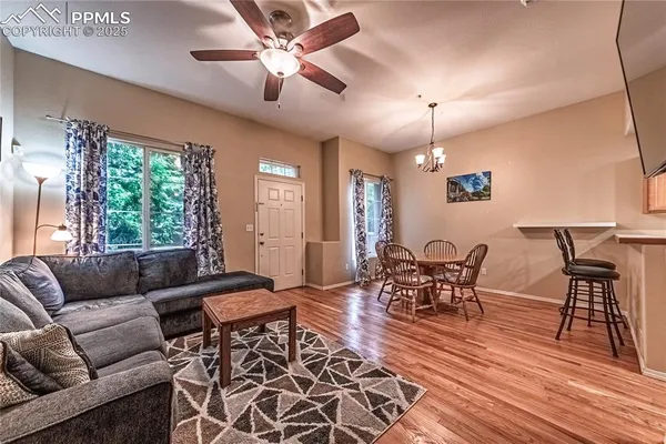 a living room with furniture and a large window