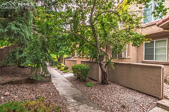 a backyard of a house with lots of green space