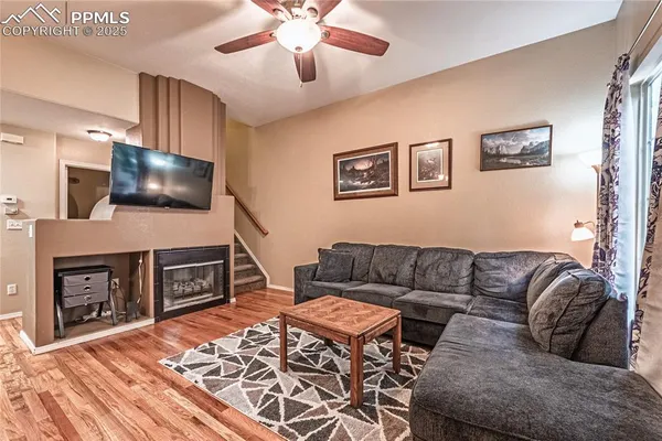a living room with furniture and a flat screen tv