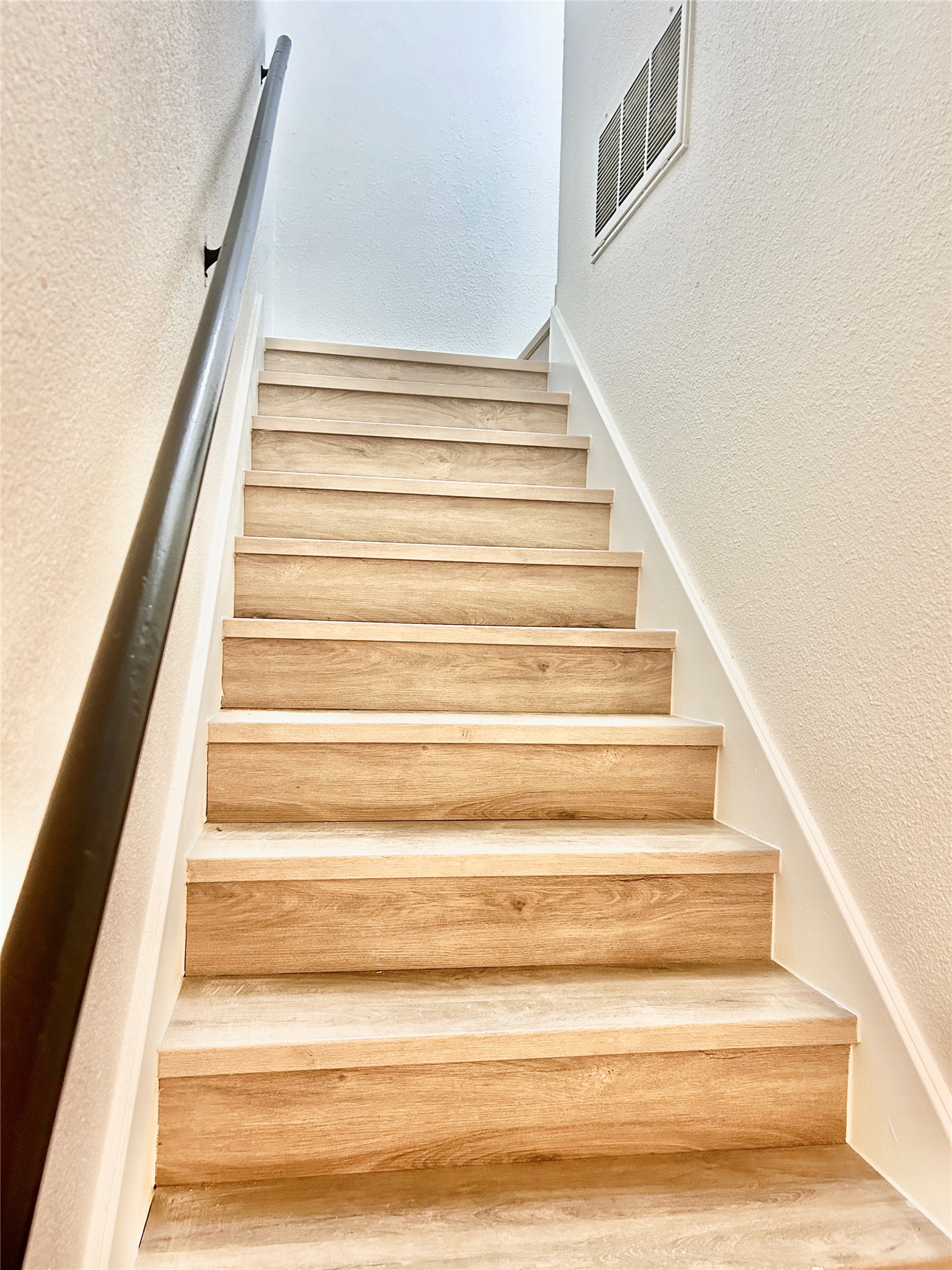 5903 Cougar Drive, Unit C Austin, TX 78745 - Photo 11 of 16 Staircase with a textured wall