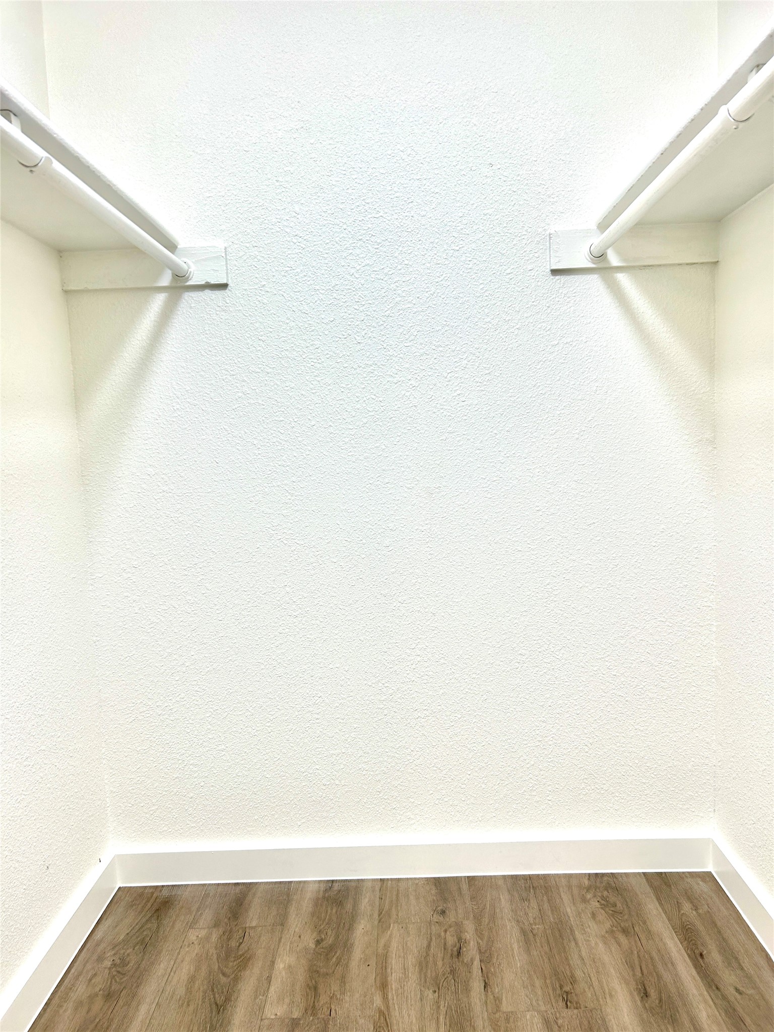 5903 Cougar Drive, Unit C Austin, TX 78745 - Photo 15 of 16 Spacious closet featuring wood finished floors