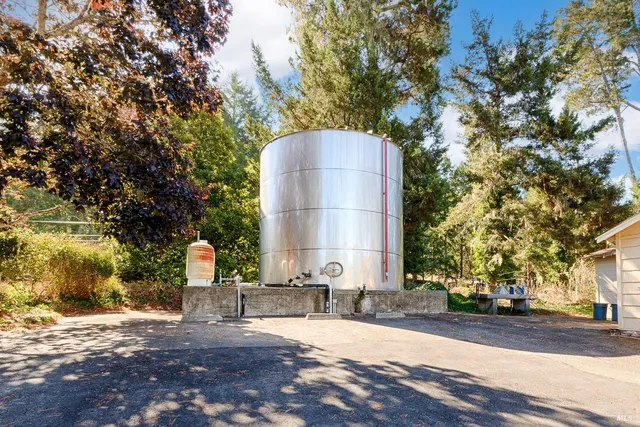 a view of a pathway with a house in the background