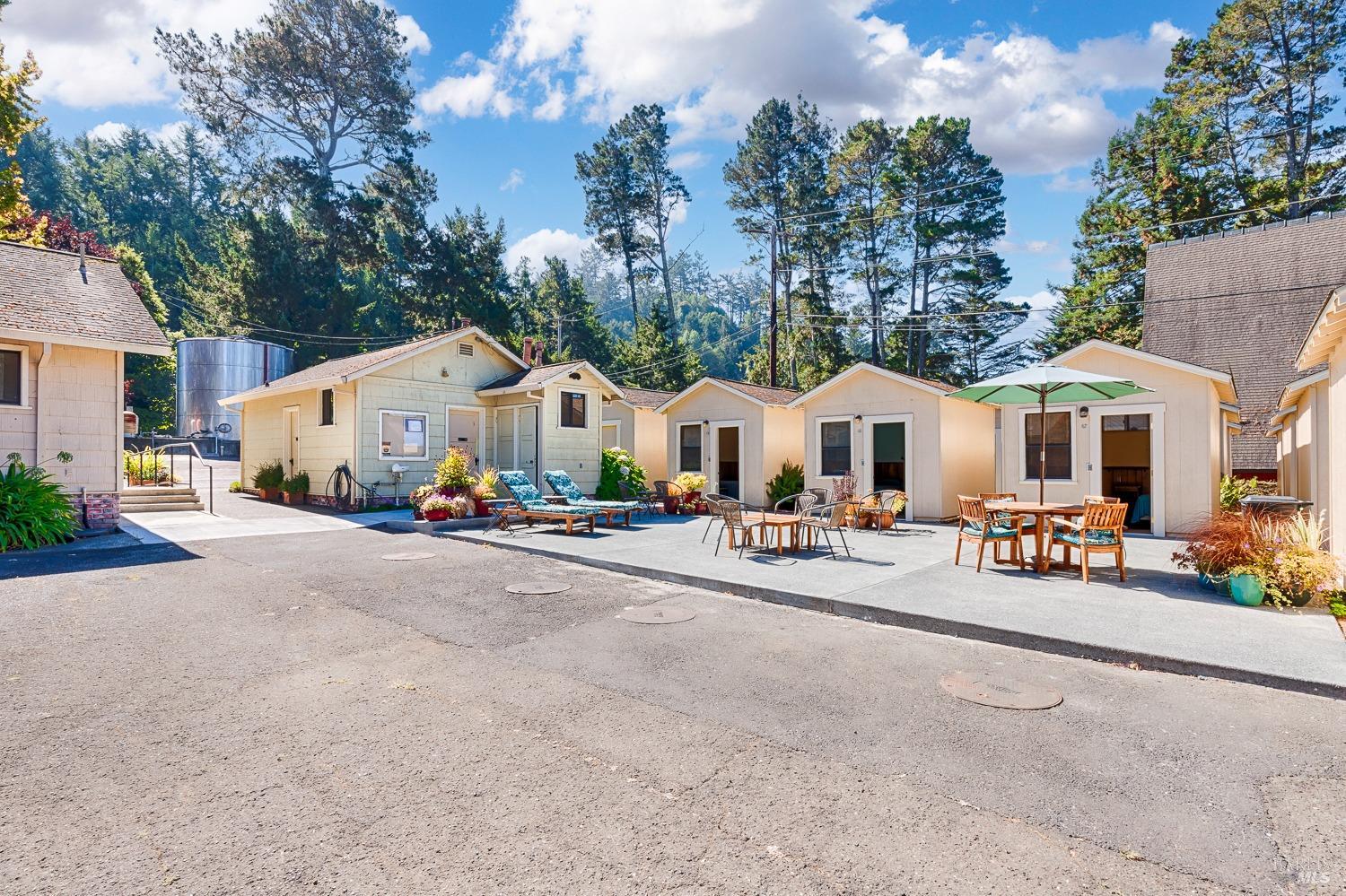 22776 Moscow Road Monte Rio, CA 95462 - Photo 18 of 20 a view of a white house with wooden fence and sitting area
