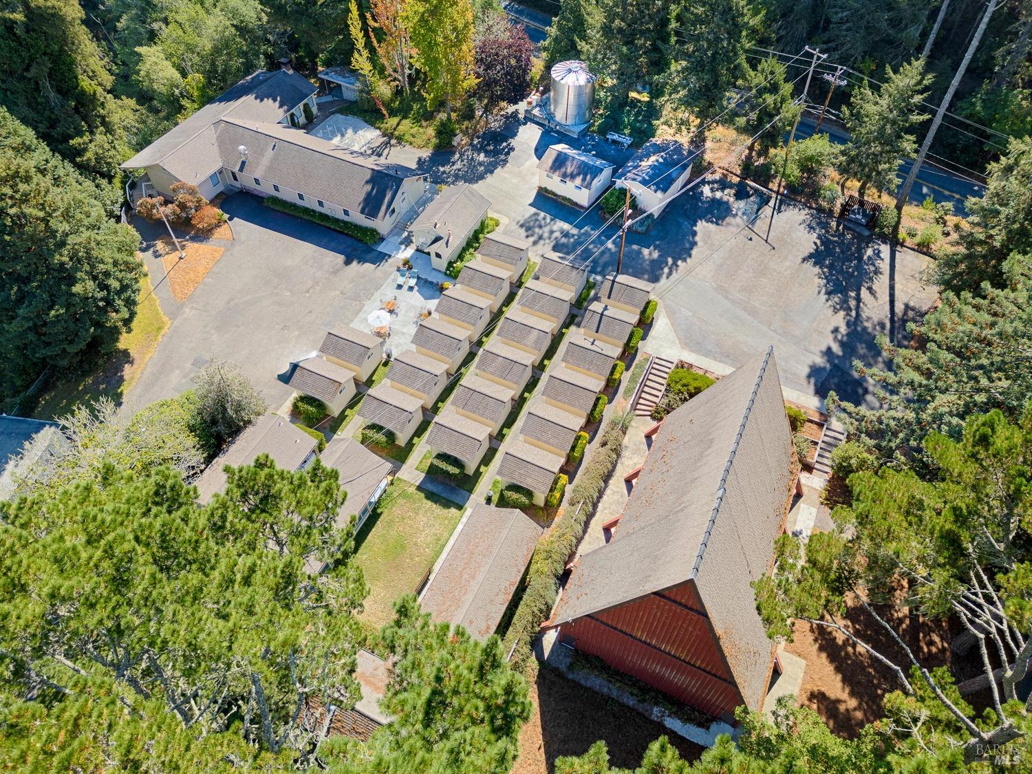 22776 Moscow Road Monte Rio, CA 95462 - Photo 8 of 20 an aerial view of a house with a yard and garden