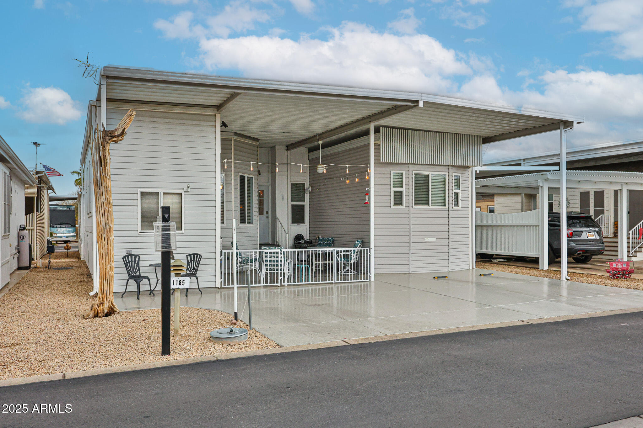 a patio with table and chairs