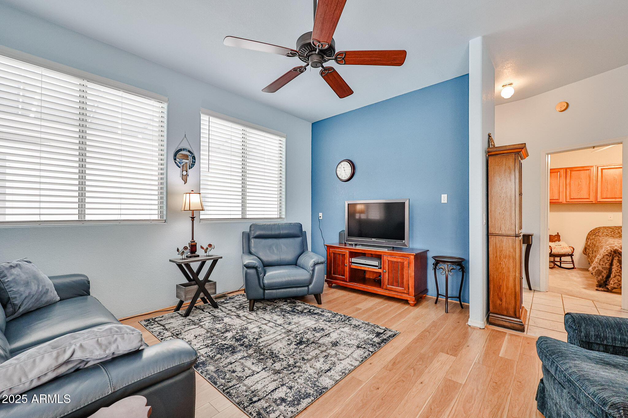 17200 West Bell Road, Unit 1185 Surprise, AZ 85374 - Photo 16 of 44 a living room with furniture and a flat screen tv