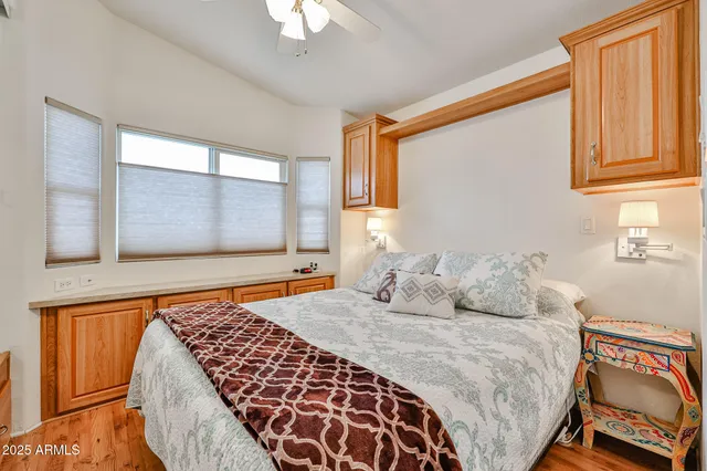 a bedroom with a large bed and a window